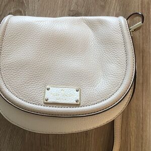 Kate Spade two-toned cream/beige cross body bag.